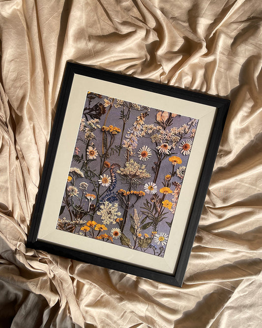 Black floral framed artwork on wall